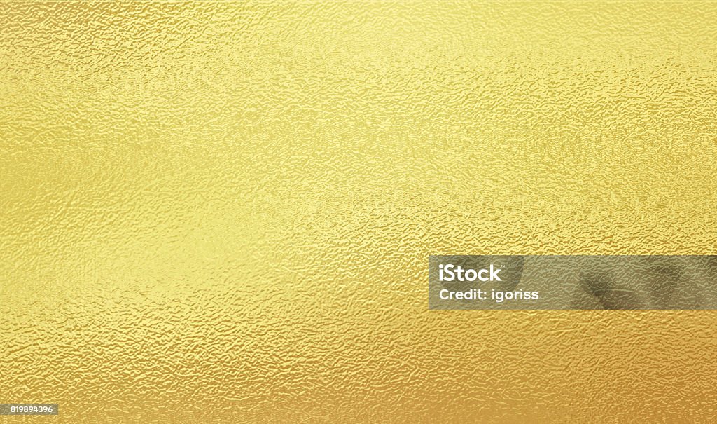 Shining gold foil Shining gold foil. Yellow metallik texture background. Gold - Metal Stock Photo