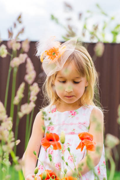 istock Girl in summer on the field 819897220