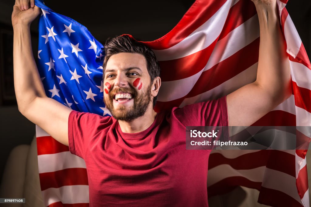 American fan holding the national flag Sport Collection Adult Stock Photo