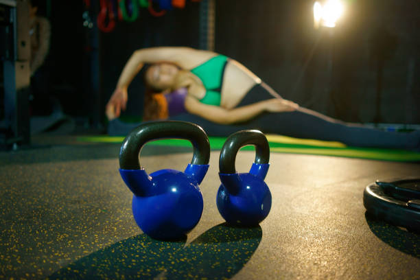 Fitness female with dumbbells