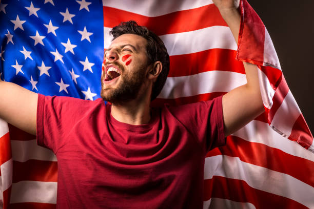 istock American fan holding the national flag 819898056