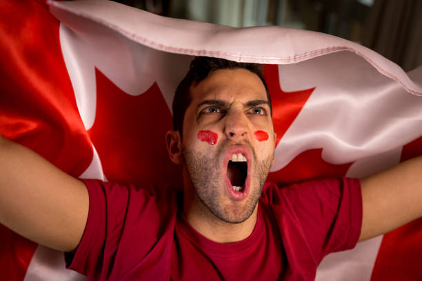 istock Canadian Guy Waving Canada Flag 819900148