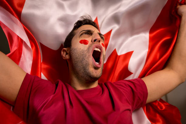 istock Canadian Guy Waving Canada Flag 819901630
