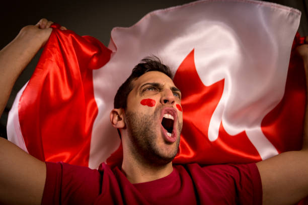 istock Canadian Guy Waving Canada Flag 819901884
