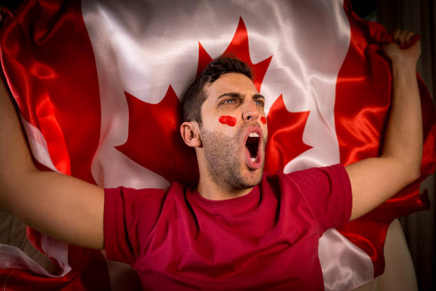 istock Canadian Guy Waving Canada Flag 819902224