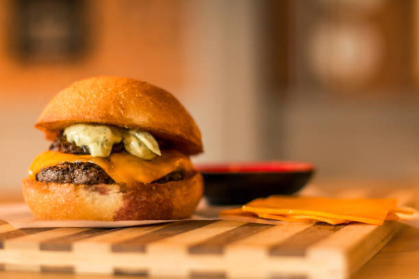 istock hamburguer artisan in table wood background 819902580