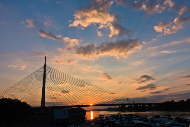 istock Silhouette of a huge cable bridge over Sava river at sunset in Belgrade 819902644