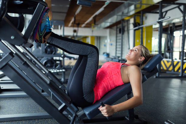 istock Woman doing exercises in gym for legs 819906232