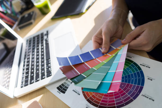 istock Female executives holding color shade swatch at her desk 819908936