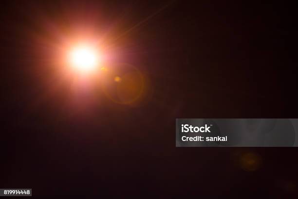 Photorealistic Lens Flare Isolated On Black Background Stock Photo - Download Image Now