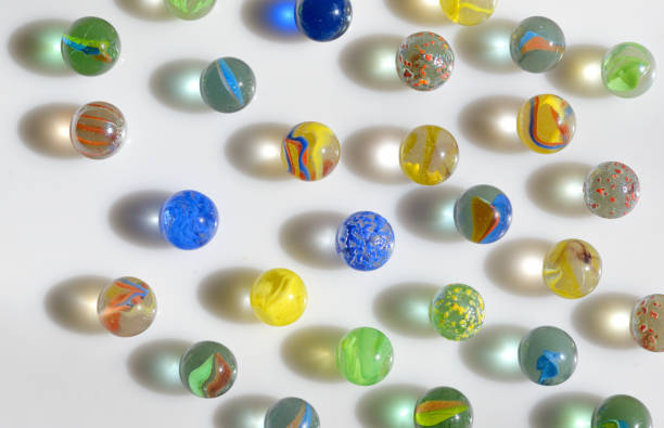 Glass marble balls and shadows stock photo