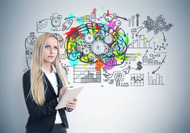 istock Blond woman with a copybook, brain cogs 819918812