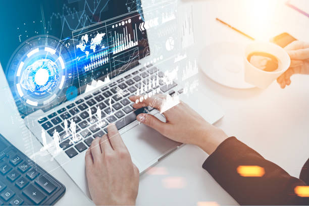 istock Woman s hands typing, holograms 819924142