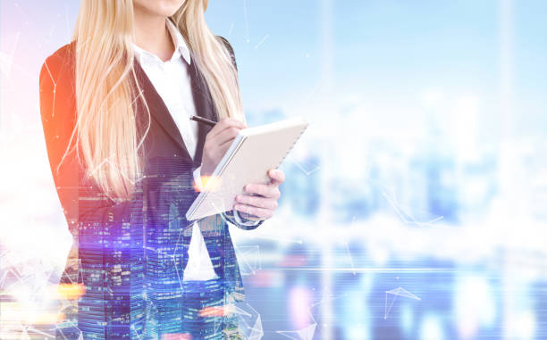 istock Blond woman with a copybook, office 819924442