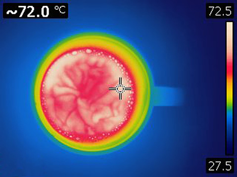 Image taken with infra red camera. Each color represents different temperatures, as is shown on spectrum scale on right side of image. Temperature in upper left corner is temperature of point where cursor is.