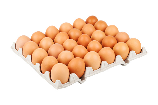 Stock photo showing elevated view of batch of eight mixed white and brown coloured eggs in open disposable cardboard egg box.