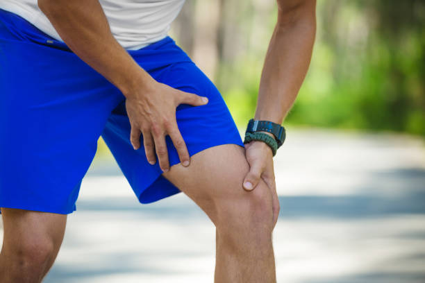 istock Man with knee pain from running injury 819952570