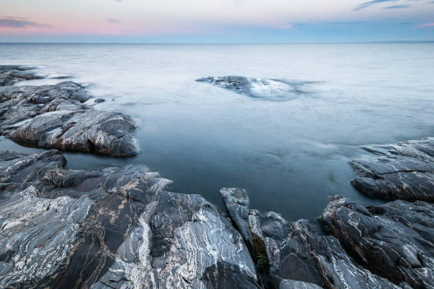 istock Tranquil morning minimalist landscape of stony coast 819952582