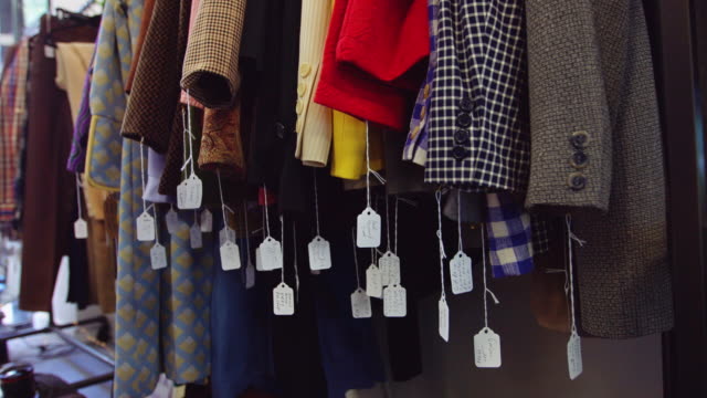 Price Tags Swinging in Second Hand Clothing Store