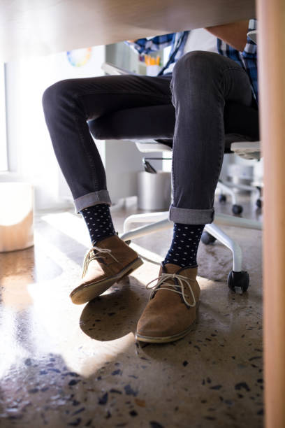 istock Male executive relaxing on chair in office 819953364
