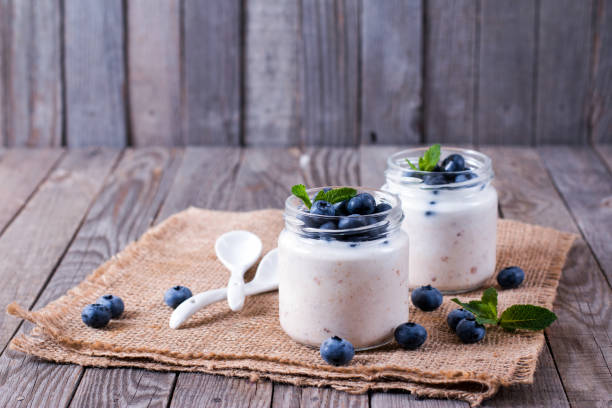 istock Fresh homemade yogurt in jars with fresh berries 819964986