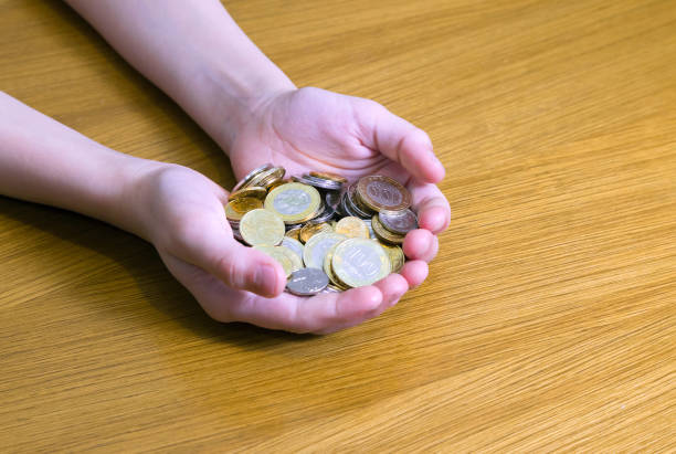istock Handful of coins 819971580