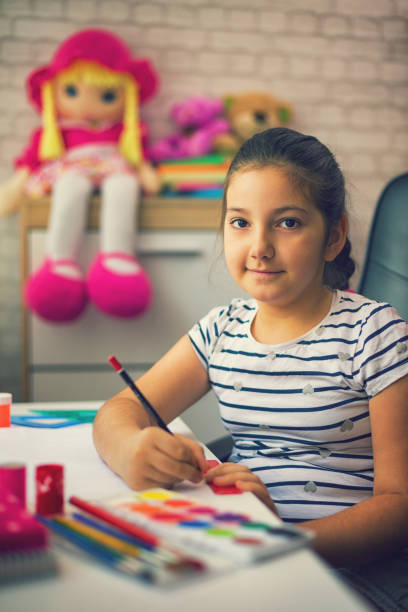 istock Beautiful Girl Doing Homework 819974858