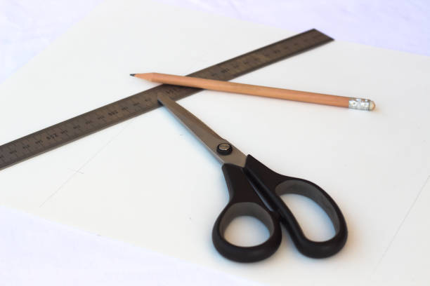 istock Scicors, Pen and Rulle on the Table 819977490
