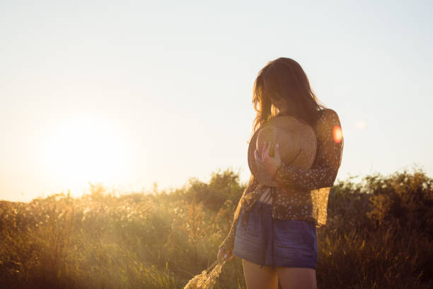istock Young beautiful woman enjoying day in nature 819979690