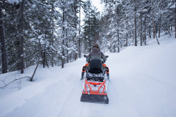 istock Snowmobile tour in remote Taiga forest. 819995614