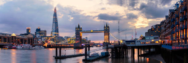 istock Panoramic view of The Shard and Tower Bridge at dusk 819999130