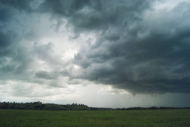 istock Storm cyclone over summer fields, hills and forests 819999586