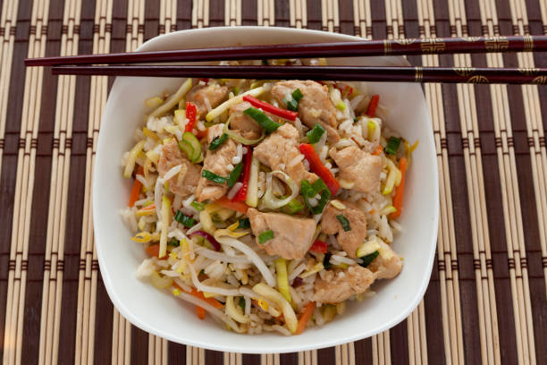 istock Asian Style Sauteed chicken with rice and vegetables. 820000314