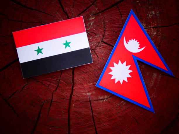 istock Syrian flag with Nepali flag on a tree stump isolated 820000332