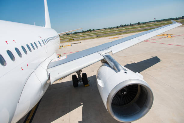 istock Passenger airplane wing with turbine 820018704