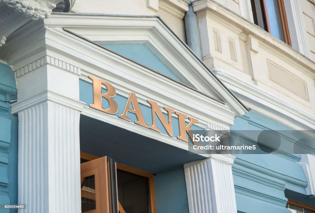 Bank sign on building Bank sign on traditional europe building facade Bank - Financial Building Stock Photo