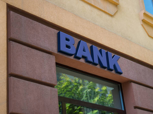 istock Blue bank sign on building facade 820024796
