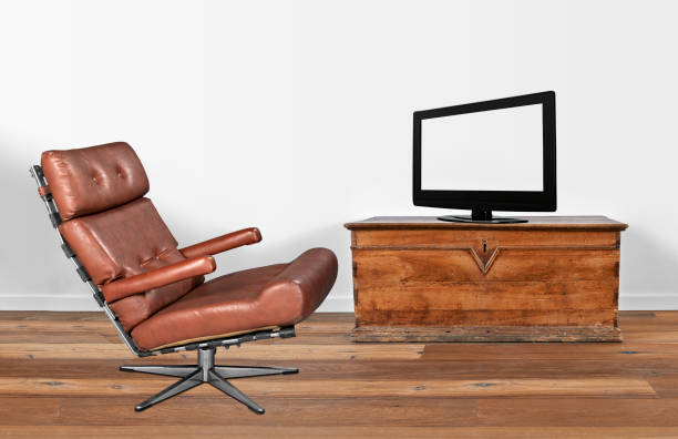 istock Soft brown leather vintage and stylish chair with television 820037576