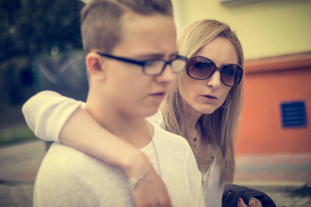 istock woman and young man on a walk 820054112