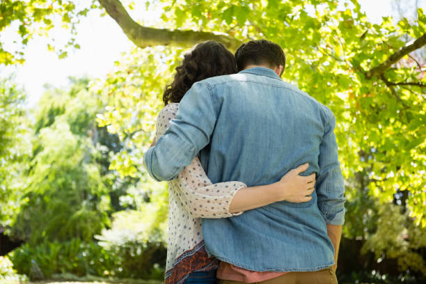 istock Couple embracing each other in garden on a sunny day 820054212