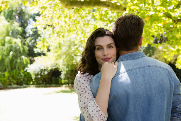istock Couple embracing each other in garden 820059032