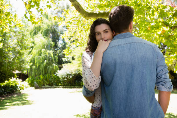 istock Couple embracing each other in garden 820059082