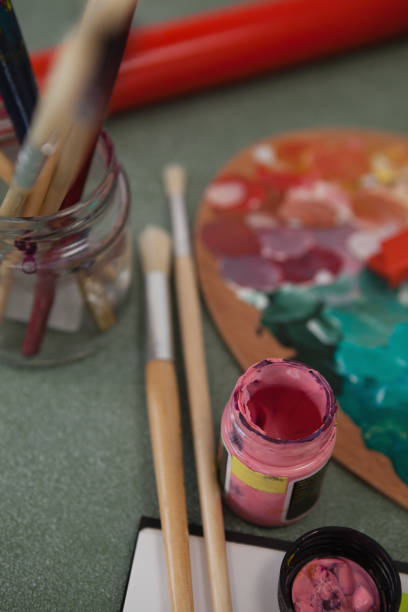istock Watercolor paint and paintbrushes on chalkboard 820059476