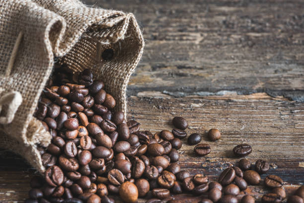 istock Coffee Beans Spilled out of Burlap Sack 820062168