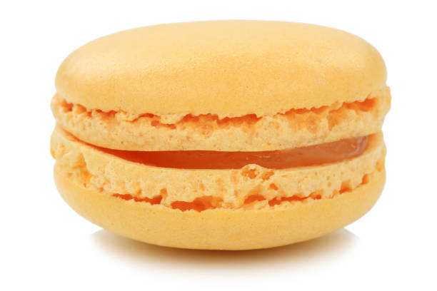 istock Orange macaron macaroon cookie dessert from France isolated 820076256
