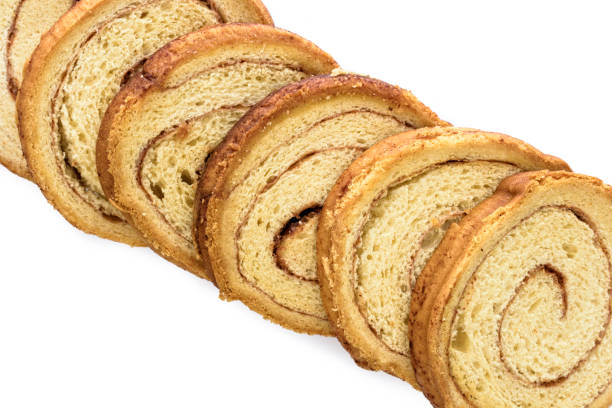 istock Slices of cinnamon brad on a white backgound 820092092