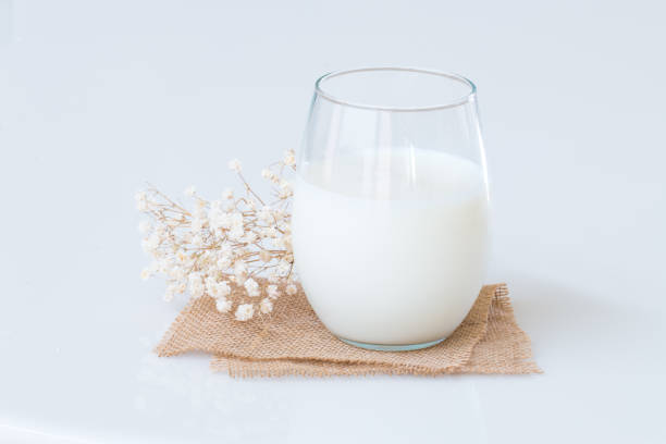 istock Fresh milk in a glass on marble table. 820111810