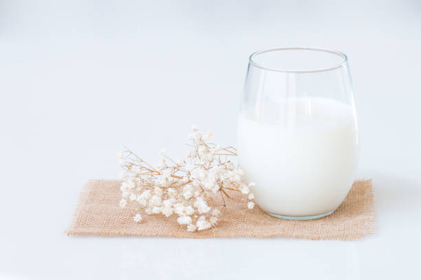 istock Fresh milk in a glass on marble table. 820111998
