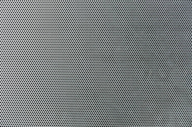 istock Gray metal background, round perforated metal texture 820112212
