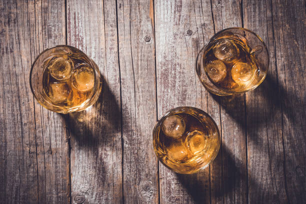 istock Whiskey glasses on an old wooden table. 820112322